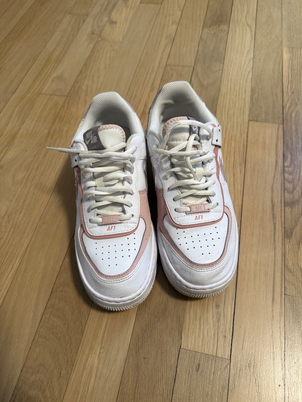 Nike White Sneakers with Pale Pink Accents